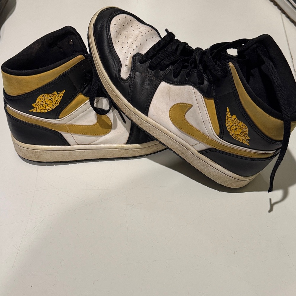 Nike Air Jordan 1 mid 
Black and Gold Sneakers